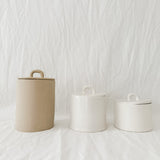 Handmade lidded ceramic storage canister with a loop handle