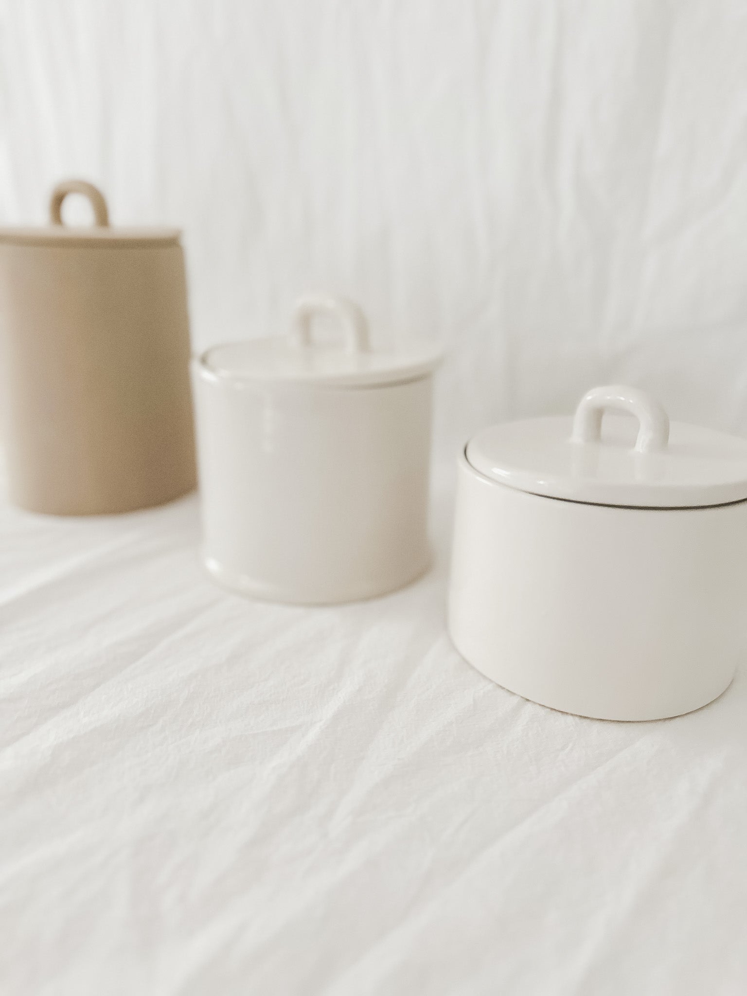 Handmade ceramic storage jar with a fitted lid, sample design