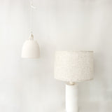 Handmade columnar ceramic lamp casting warm ambient light