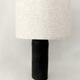 Handmade ceramic bedside lamp with linen shade and silver hardware