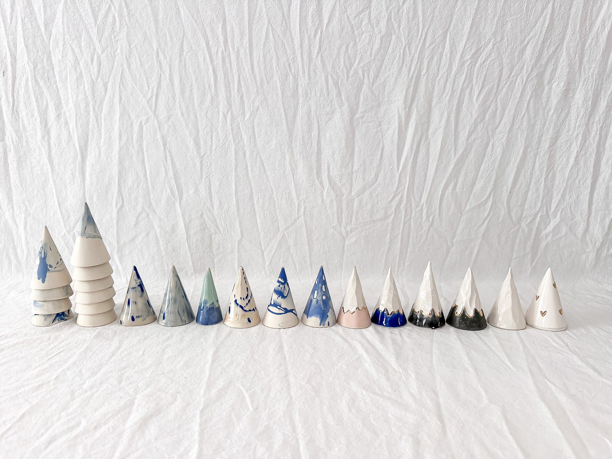 Handmade blue marbled ceramic ring cone for holding rings, 3 inches tall