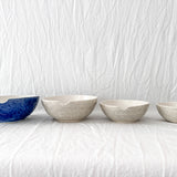 Handmade ceramic kitchen bowls in crackle white and cobalt blue glaze, dishwasher-safe seconds-sale pieces from Muddy Heart