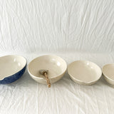 Handmade ceramic kitchen bowls in crackle white and cobalt blue glaze, dishwasher-safe seconds-sale pieces from Muddy Heart