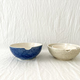 Handmade ceramic kitchen bowls in crackle white and cobalt blue glaze, dishwasher-safe seconds-sale pieces from Muddy Heart