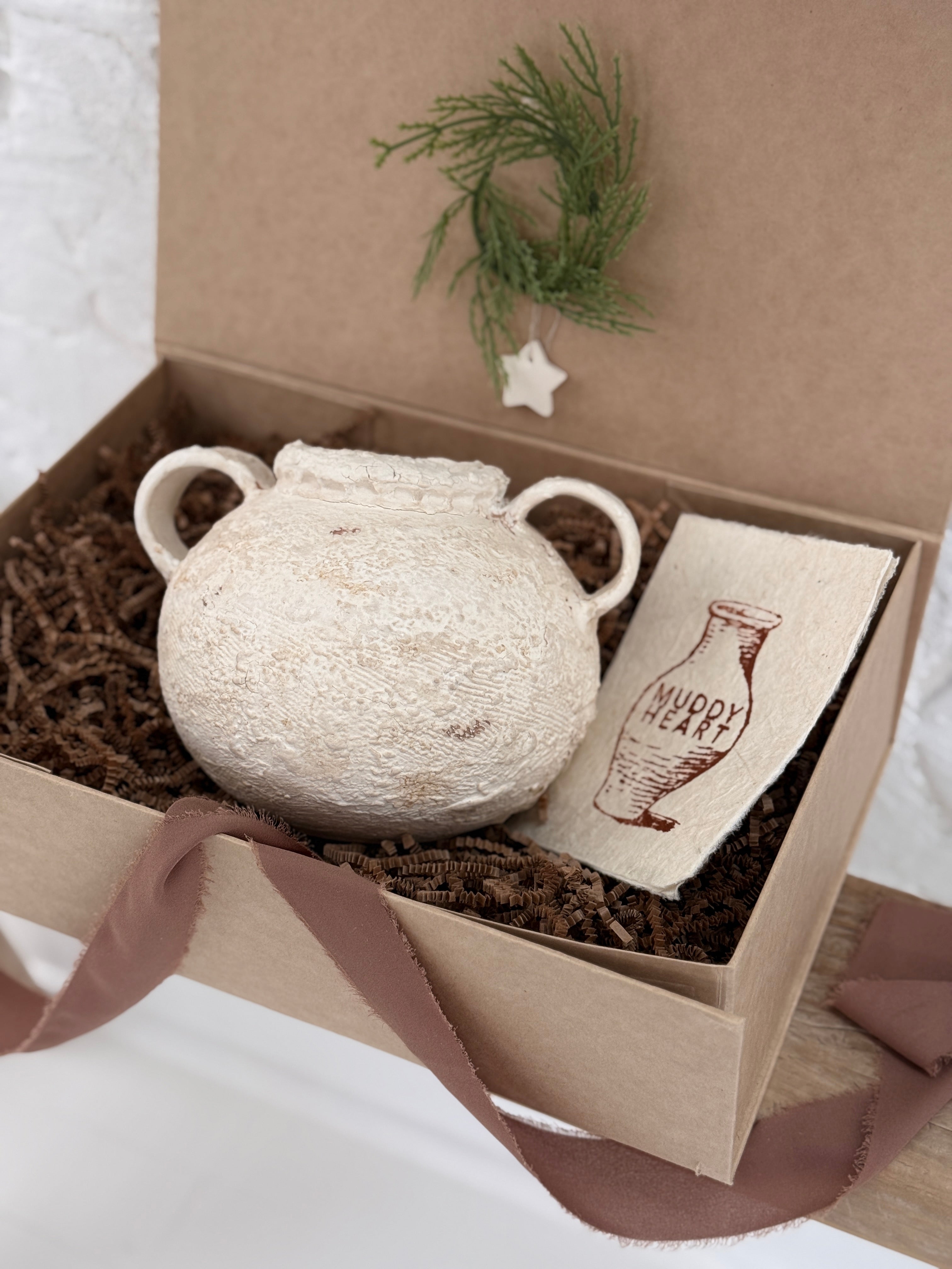 Handmade ceramic olive jar with a soft old-world texture in a neutral finish.