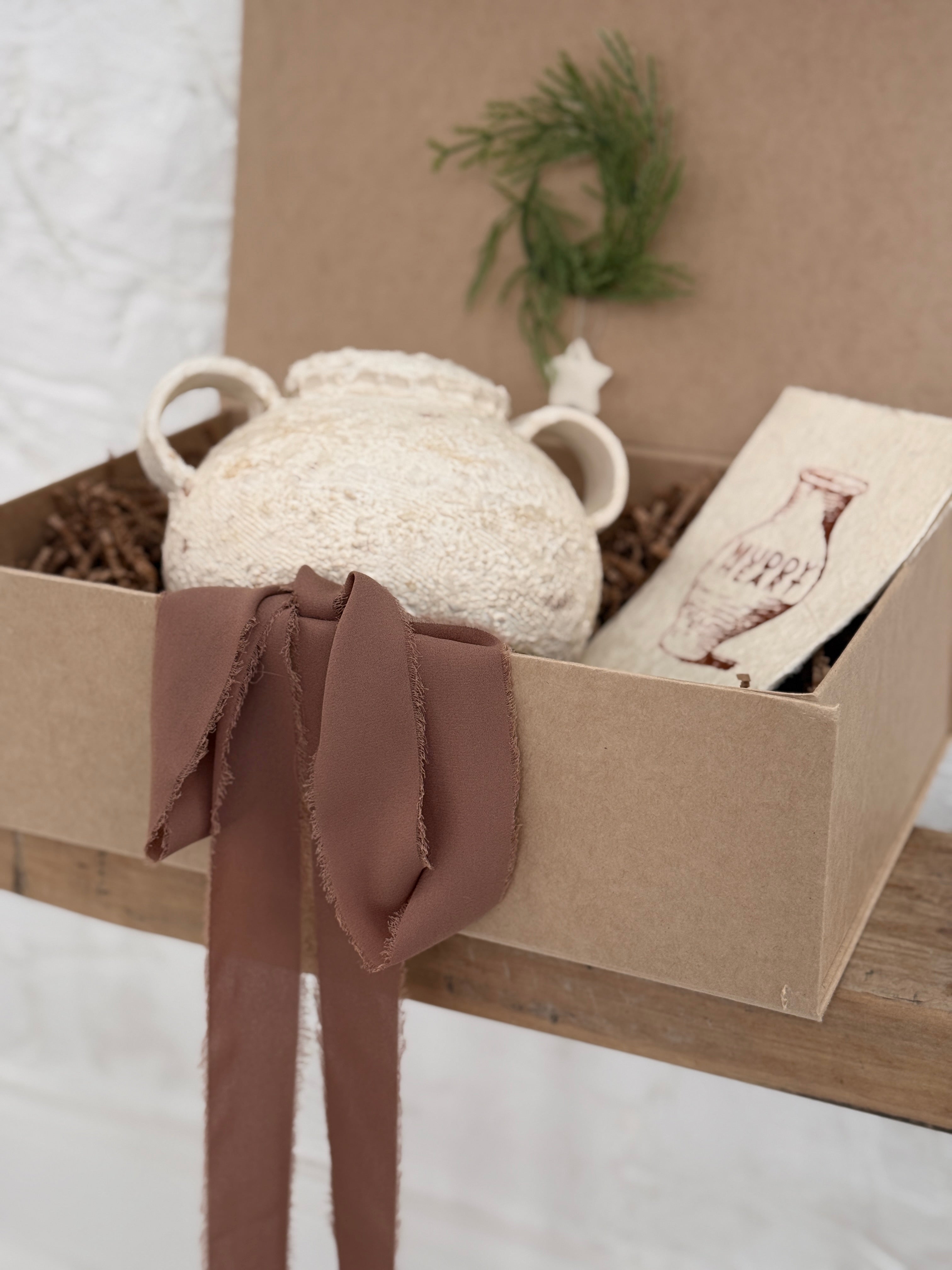 Handmade ceramic olive jar with a soft old-world texture in a neutral finish.