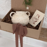 Handmade ceramic olive jar with a soft old-world texture in a neutral finish.