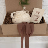 Handmade ceramic olive jar with a soft old-world texture in a neutral finish.