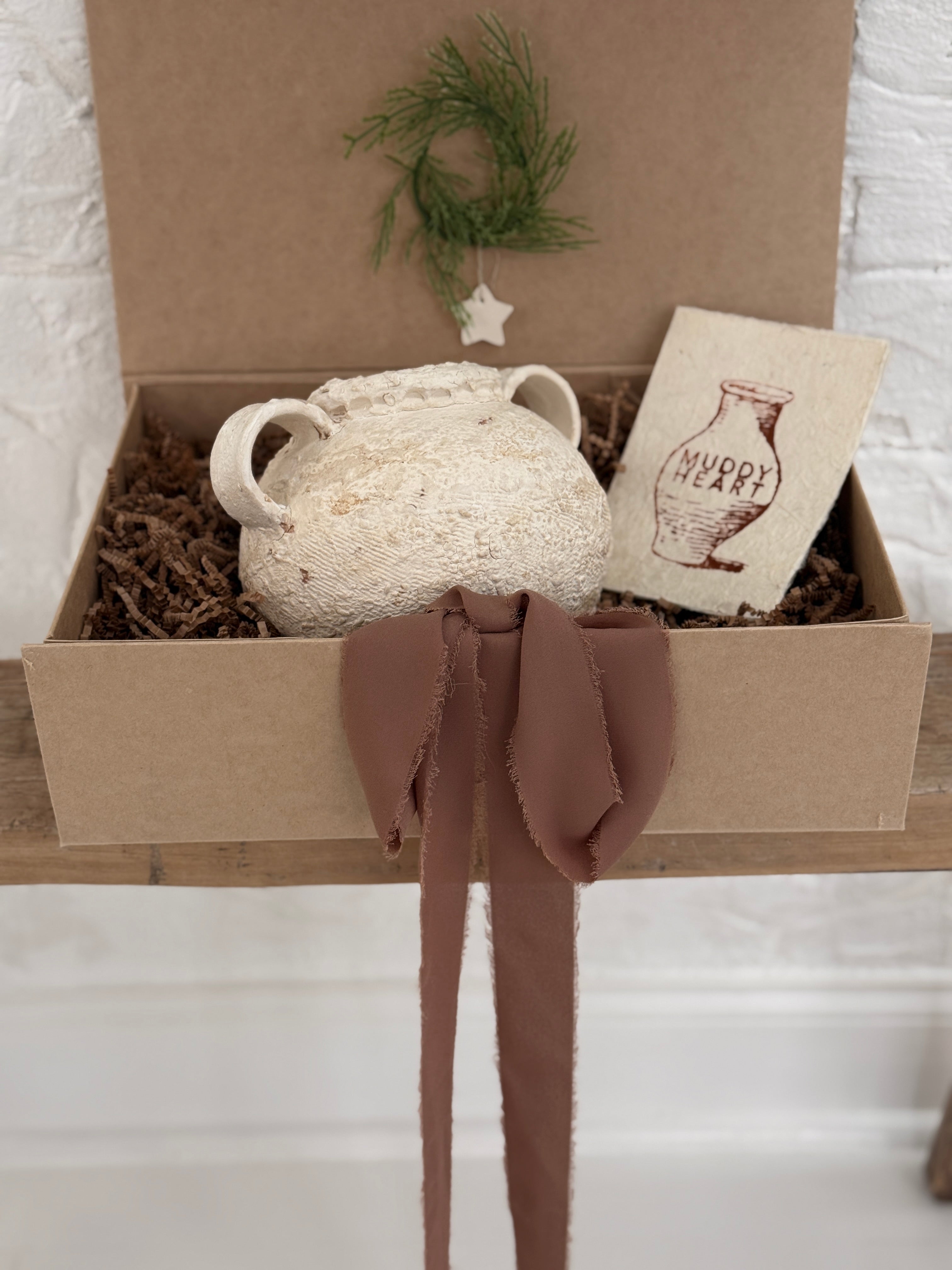 Handmade ceramic olive jar with a soft old-world texture in a neutral finish.