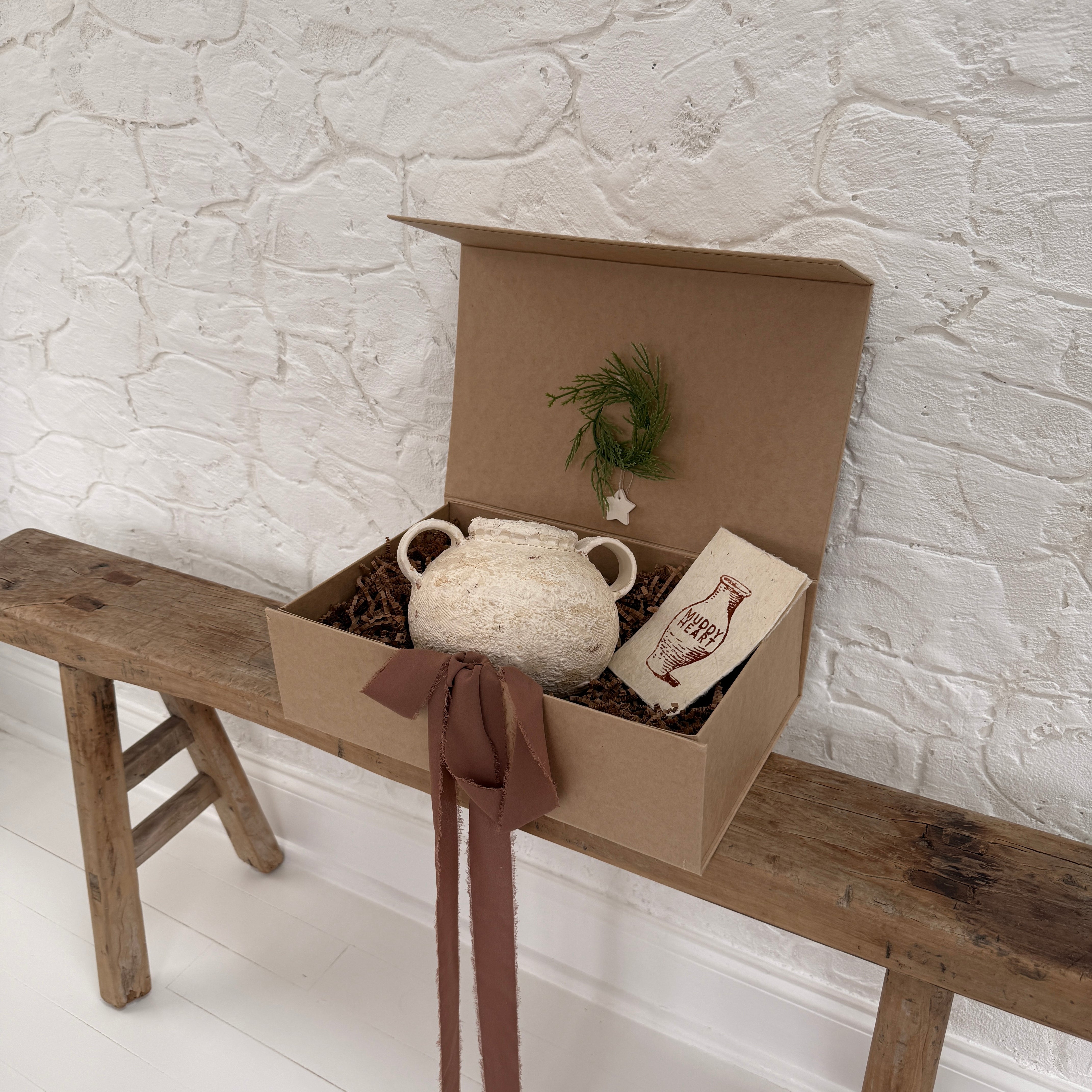 Handmade ceramic olive jar with a soft old-world texture in a neutral finish.