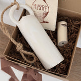 Long handmade ceramic bell in a frost white finish with a solid wood wall peg.