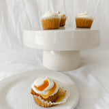 Handmade white ceramic cake stand with a delicate lace-textured plate in glossy white glaze, made to order by Muddy Heart