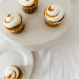 Handmade white ceramic cake stand with a delicate lace-textured plate in glossy white glaze, made to order by Muddy Heart
