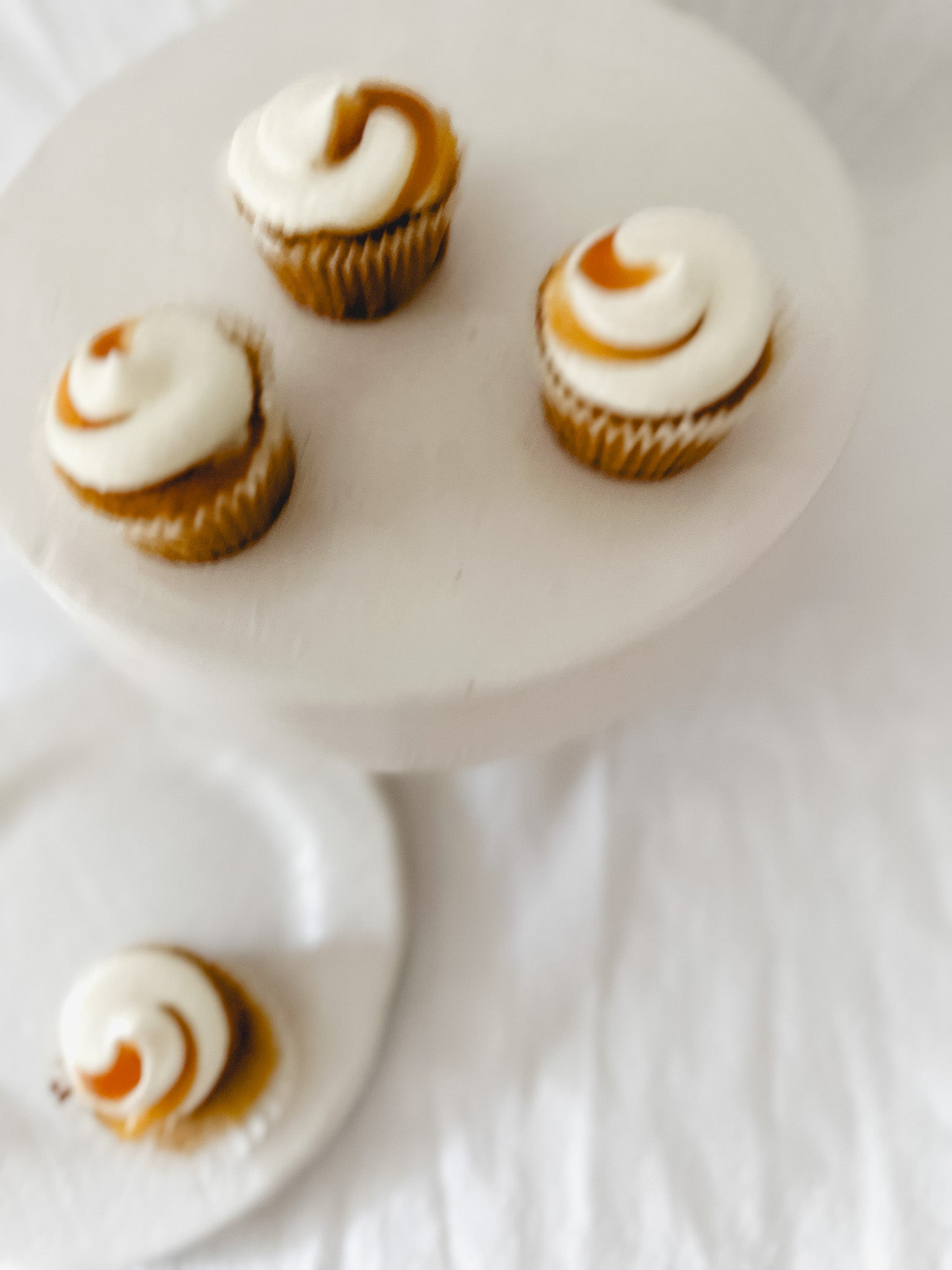 Handmade white ceramic cake stand with a delicate lace-textured plate in glossy white glaze, made to order by Muddy Heart