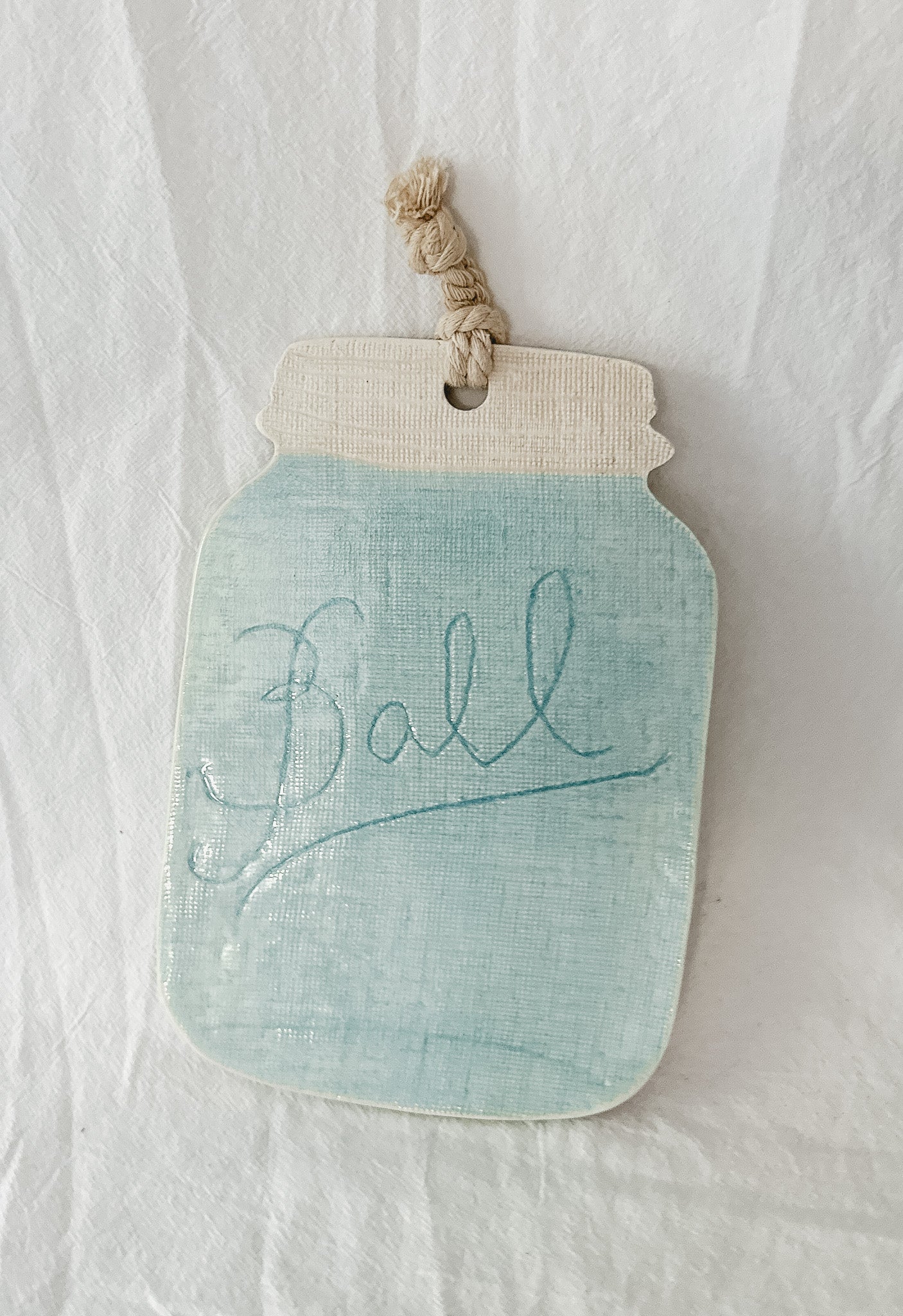 Handmade turquoise ceramic cheese and charcuterie board with a ball mason jar accent, seconds-sale piece from Muddy Heart