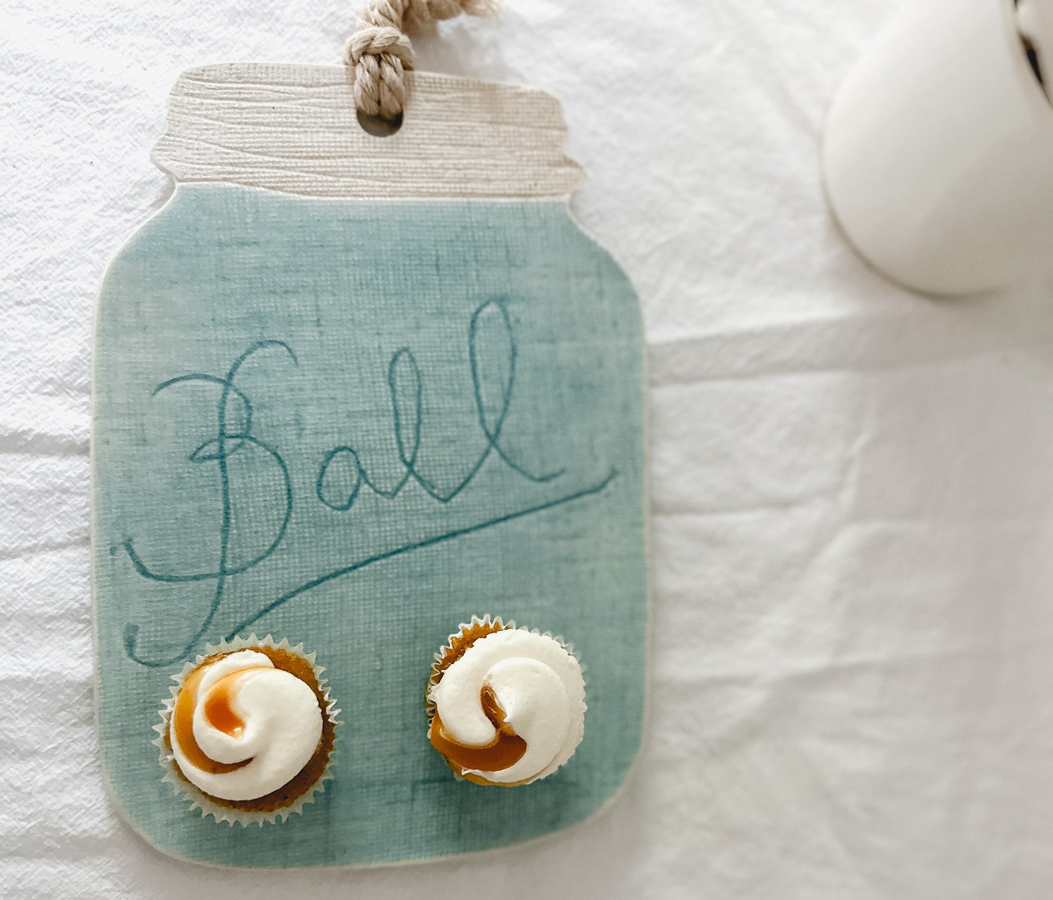 Handmade turquoise ceramic cheese and charcuterie board with a ball mason jar accent, seconds-sale piece from Muddy Heart