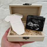 Custom porcelain baby announcement ornament and gift set presented in a wooden keepsake box