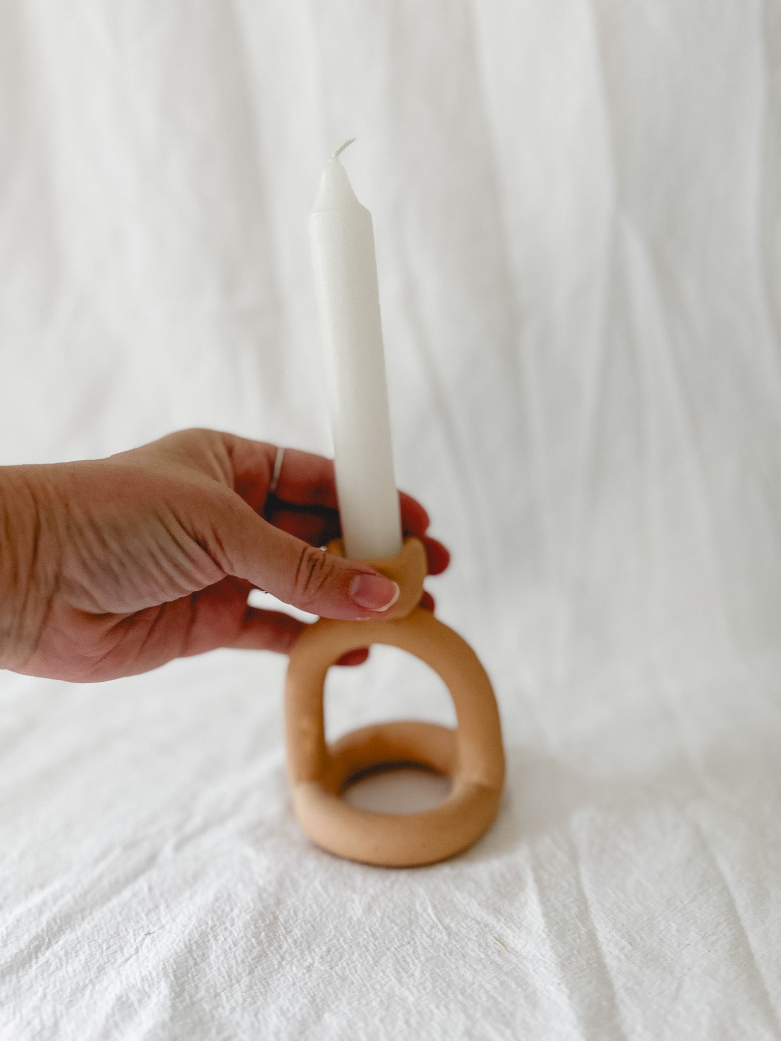 Handmade ceramic arc-shaped taper candle holder, seconds-sale piece from Muddy Heart