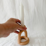 Handmade ceramic arc-shaped taper candle holder, seconds-sale piece from Muddy Heart