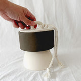 Handmade ceramic lidded vessel on a pedestal base for small storage, seconds-sale piece from Muddy Heart
