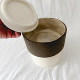 Handmade ceramic lidded vessel on a pedestal base for small storage, seconds-sale piece from Muddy Heart