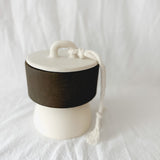 Handmade ceramic lidded vessel on a pedestal base for small storage, seconds-sale piece from Muddy Heart