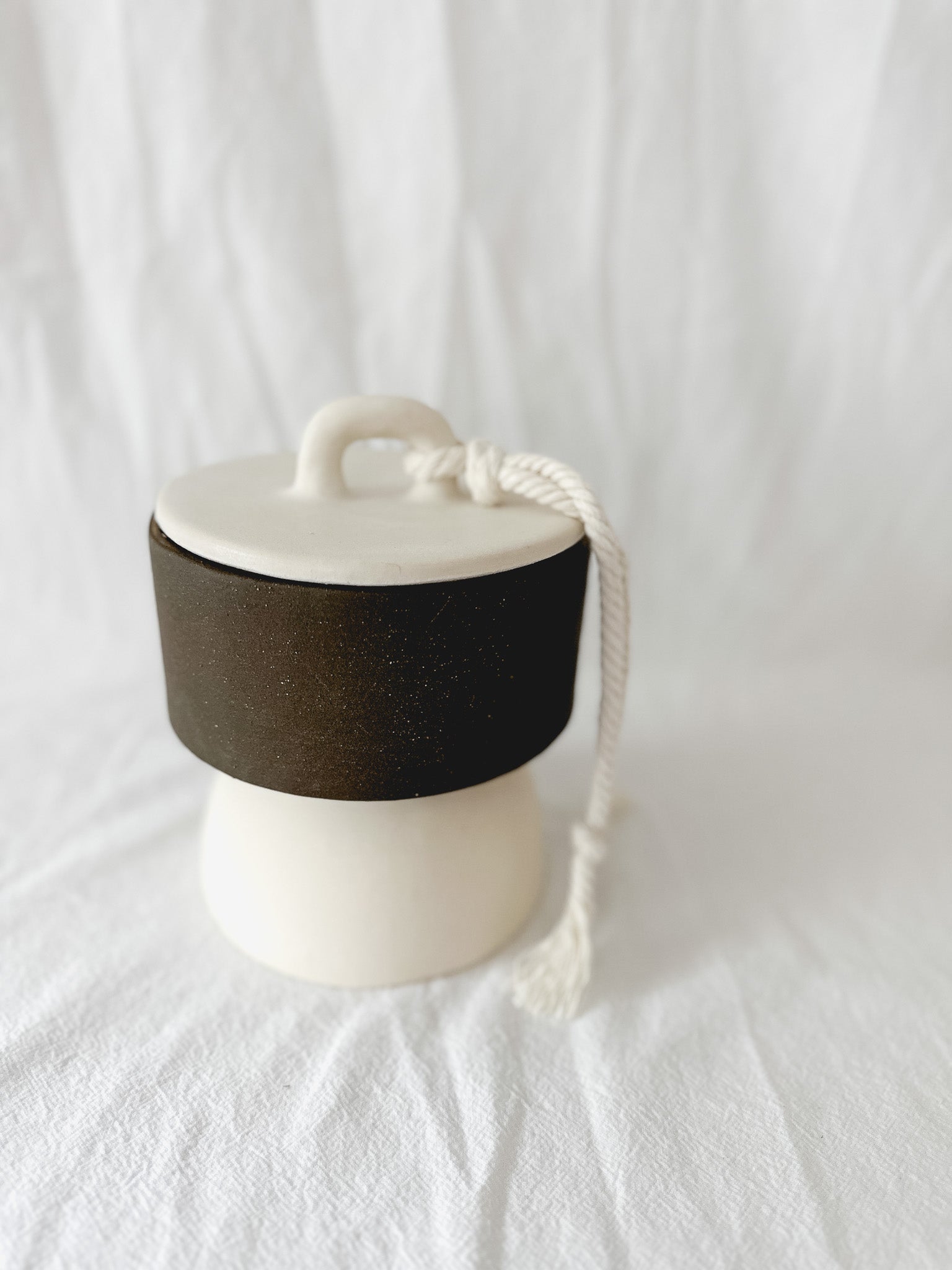 Handmade ceramic lidded vessel on a pedestal base for small storage, seconds-sale piece from Muddy Heart
