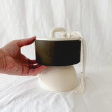 Handmade ceramic lidded vessel on a pedestal base for small storage, seconds-sale piece from Muddy Heart