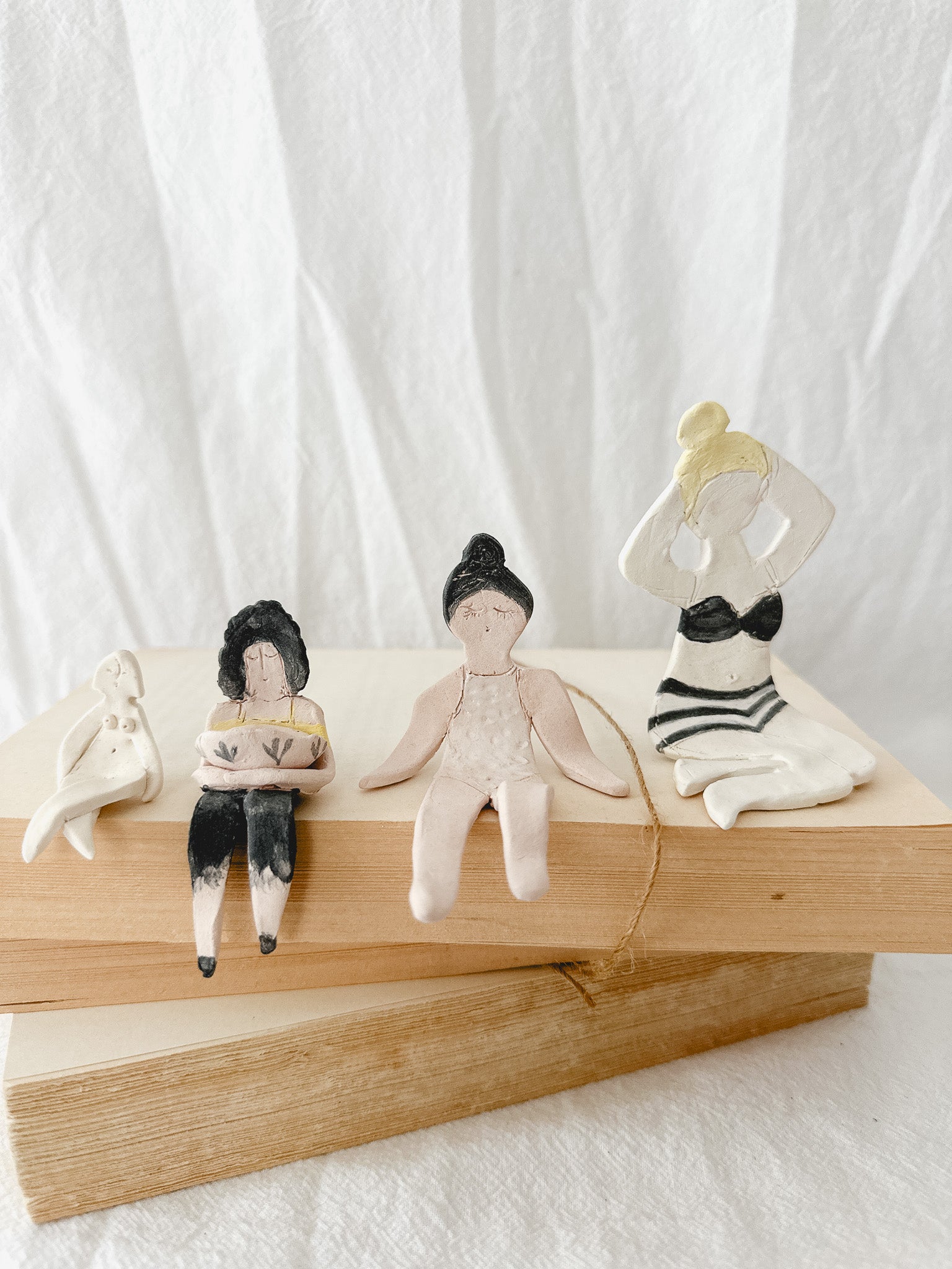 Small handmade ceramic doll figurines in assorted styles, one-of-a-kind seconds-sale collectibles from Muddy Heart