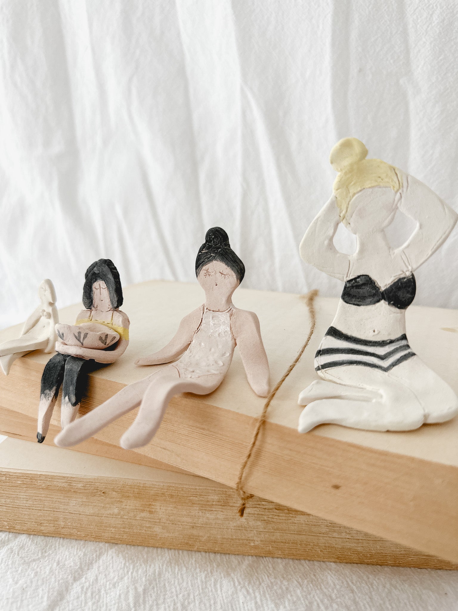 Small handmade ceramic doll figurines in assorted styles, one-of-a-kind seconds-sale collectibles from Muddy Heart