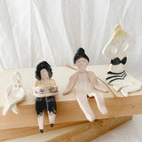 Small handmade ceramic doll figurines in assorted styles, one-of-a-kind seconds-sale collectibles from Muddy Heart