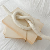 Handmade ceramic love knot decor object in textured white glaze, 12 inches long, one-of-a-kind piece from Muddy Heart