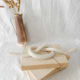 Handmade ceramic love knot decor object in textured white glaze, 12 inches long, one-of-a-kind piece from Muddy Heart