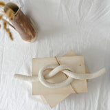 Handmade ceramic love knot decor object in textured white glaze, 12 inches long, one-of-a-kind piece from Muddy Heart