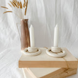 Handmade ceramic taper candle holder formed from interlocking loops, seconds-sale piece from Muddy Heart