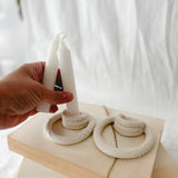 Handmade ceramic taper candle holder formed from interlocking loops, seconds-sale piece from Muddy Heart