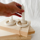 Handmade ceramic taper candle holder formed from interlocking loops, seconds-sale piece from Muddy Heart
