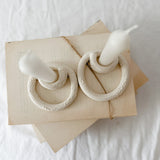 Handmade ceramic taper candle holder formed from interlocking loops, seconds-sale piece from Muddy Heart