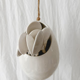 Handmade gloss white ceramic pod-shaped hanging vessel on an 18-inch rope, for flowers or trailing plants, seconds-sale piece from Muddy Heart