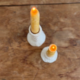 Trio of handmade ceramic candlesticks in varied heights for taper candles.
