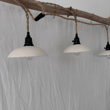Neutral ceramic plug-in pendant trio for whole-room lighting