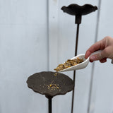 Handmade stoneware bird feeder and bath with pressed flower and leaf detailing for the garden.