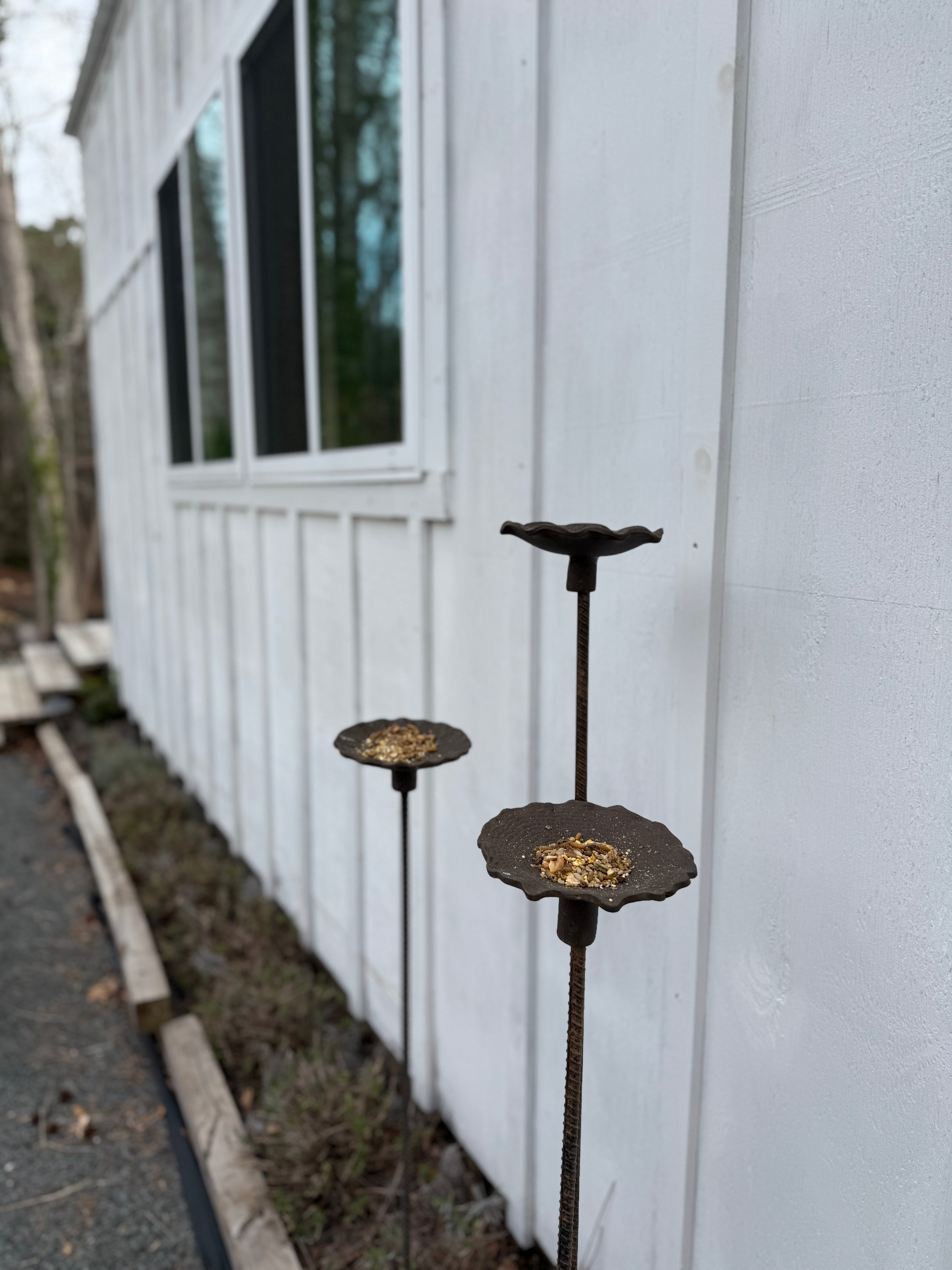 Handmade stoneware bird feeder and bath with pressed flower and leaf detailing for the garden.