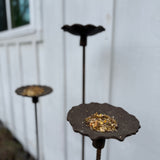 Handmade stoneware bird feeder and bath with pressed flower and leaf detailing for the garden.