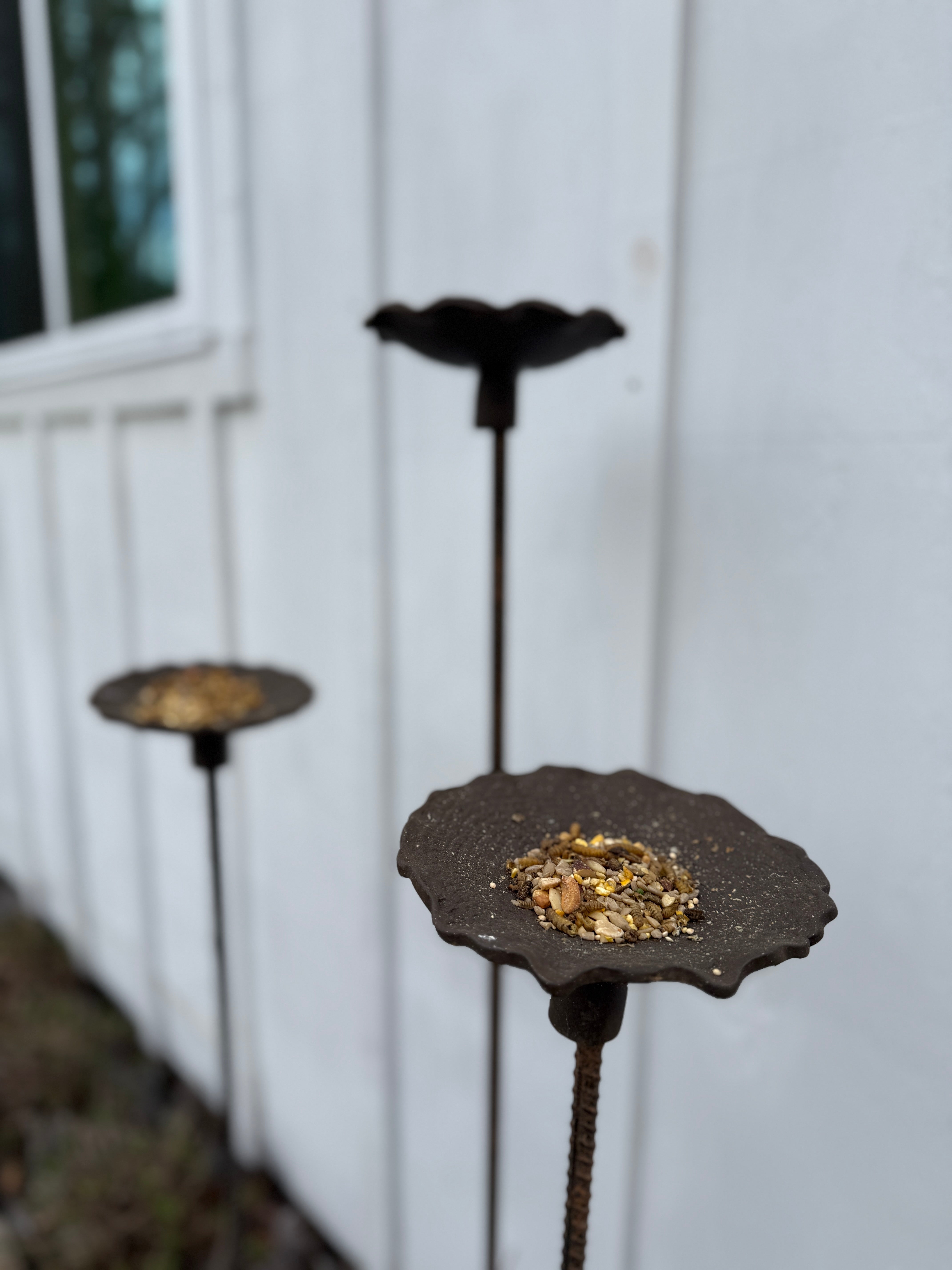 Handmade stoneware bird feeder and bath with pressed flower and leaf detailing for the garden.