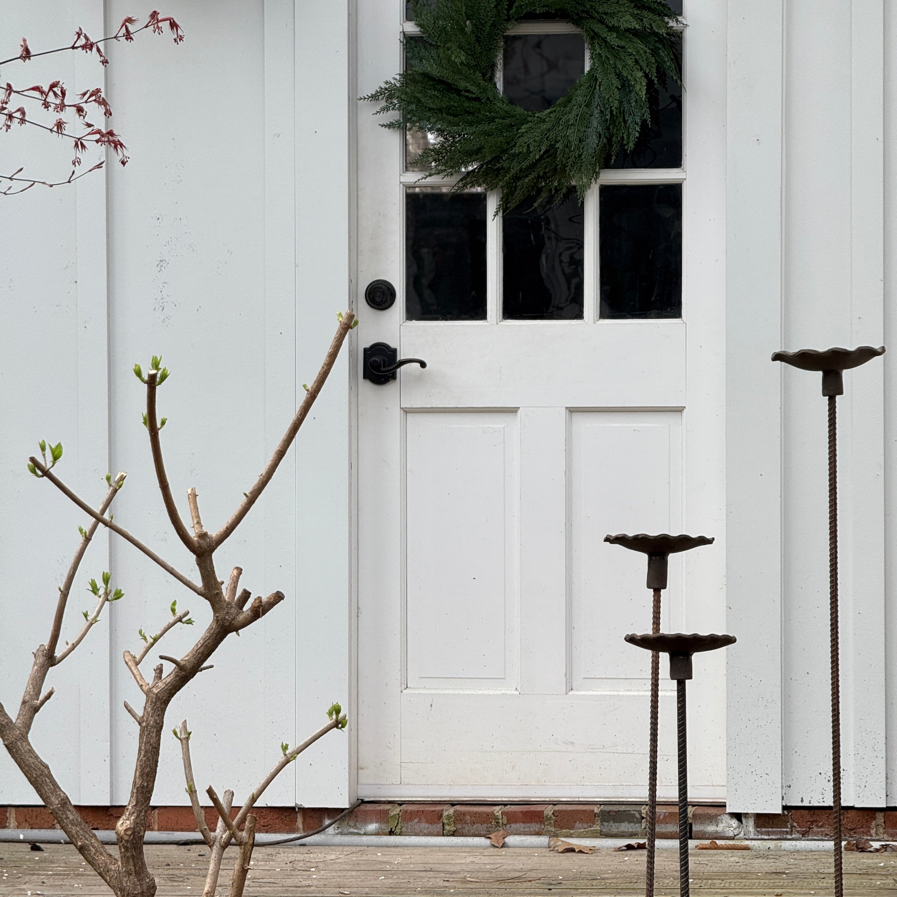 Handmade stoneware bird feeder and bath with pressed flower and leaf detailing for the garden.