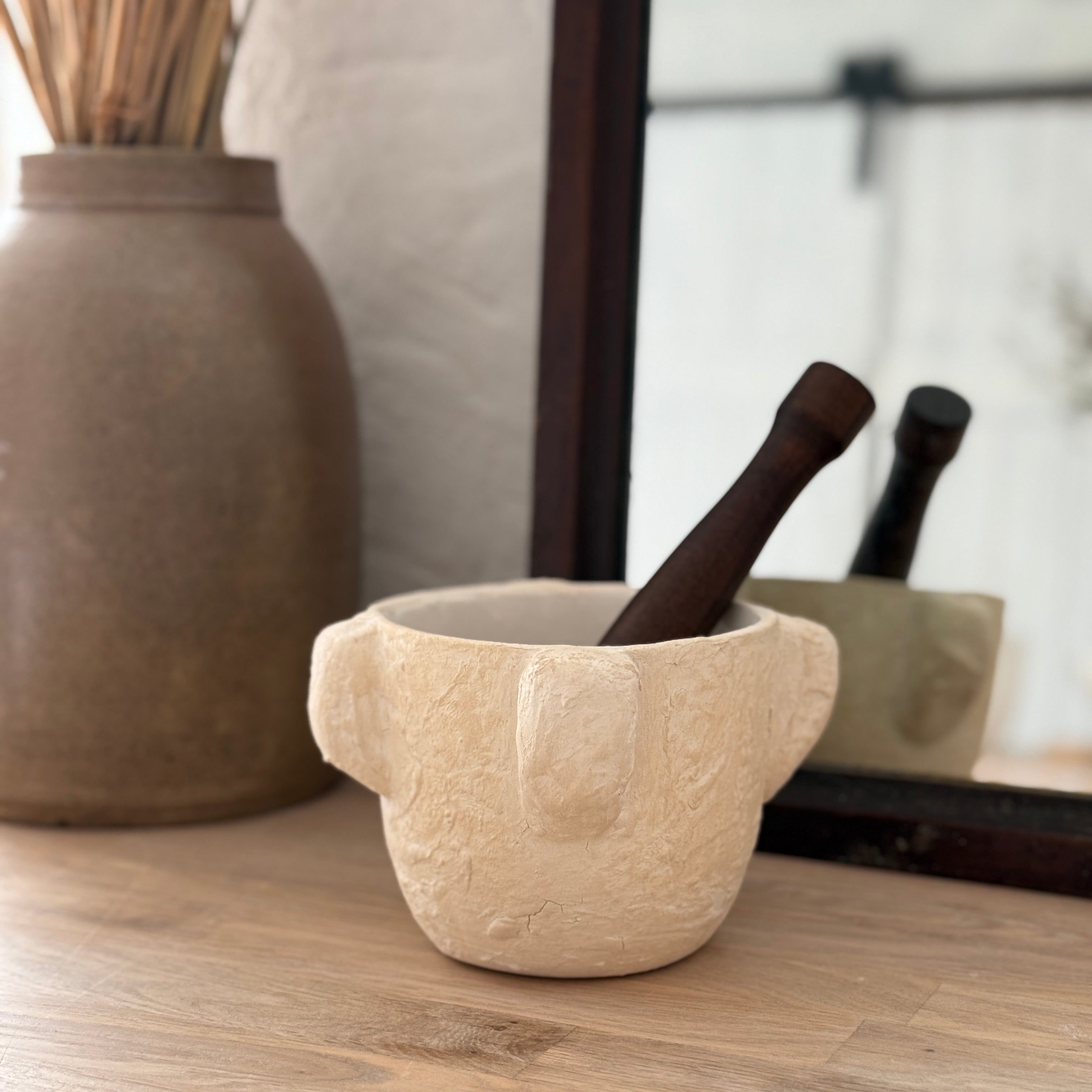 Handmade ceramic mortar and pestle inspired by ancient stone kitchen tools