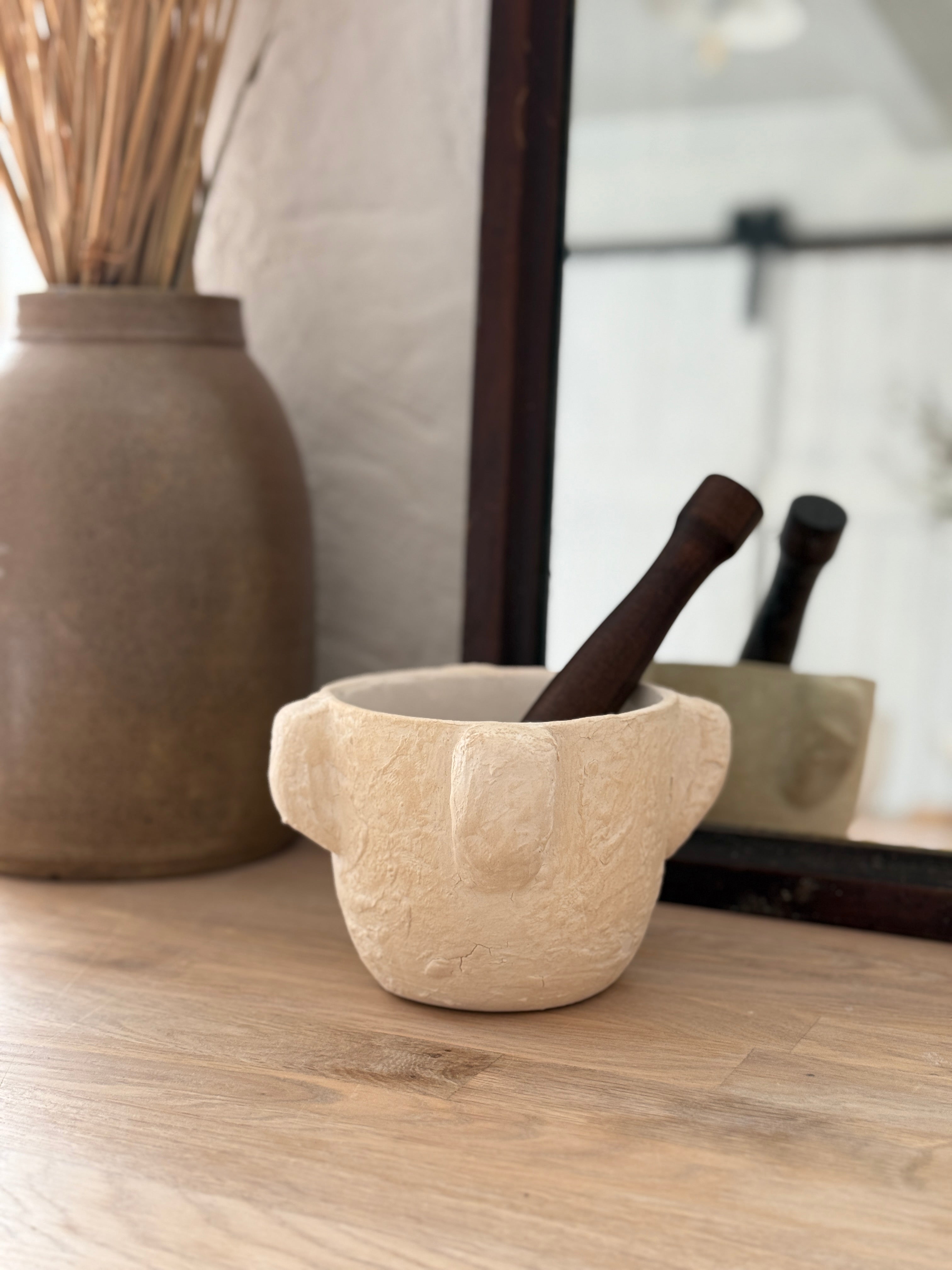 Handmade ceramic mortar and pestle inspired by ancient stone kitchen tools