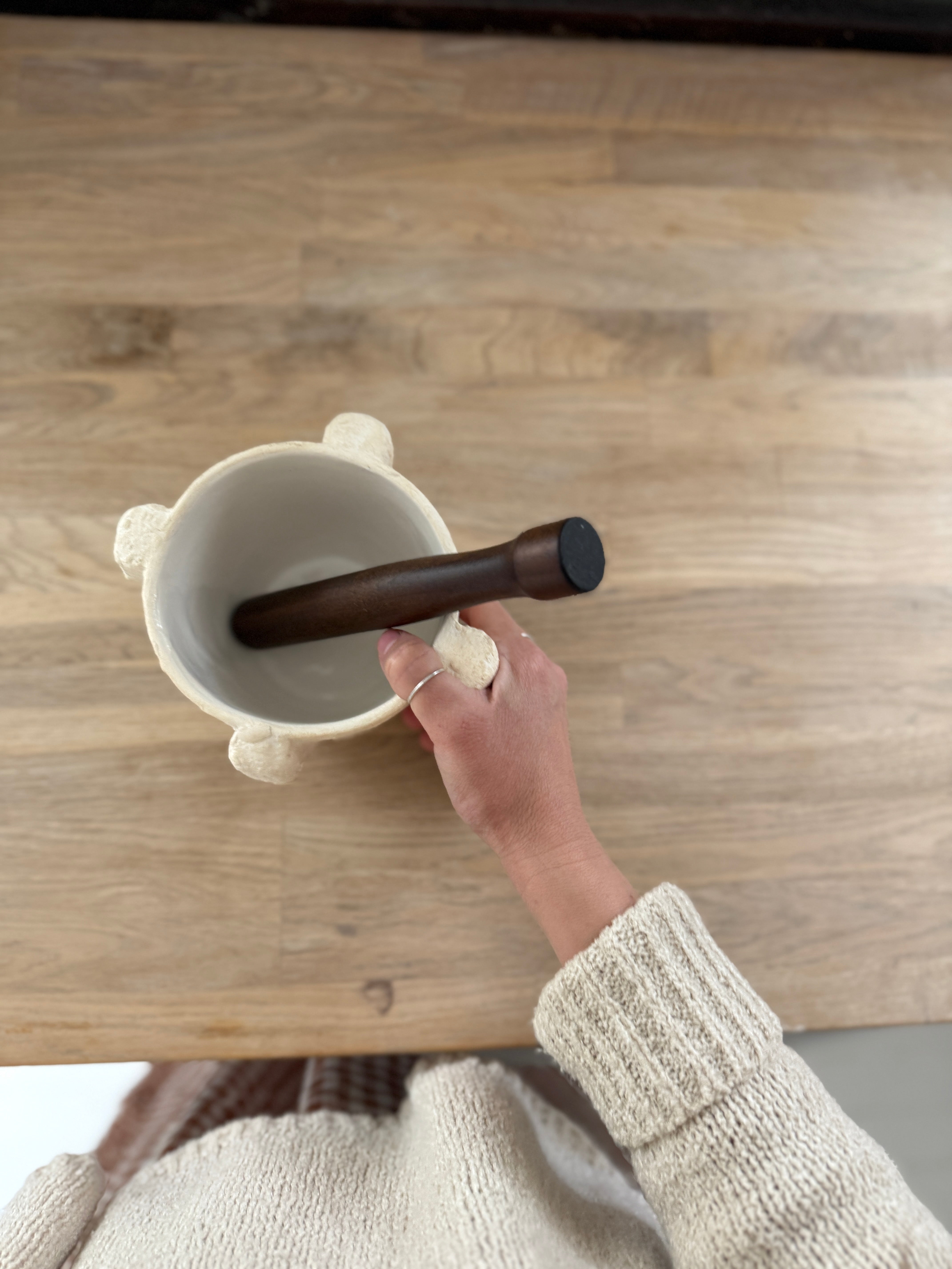 Handmade ceramic mortar and pestle inspired by ancient stone kitchen tools