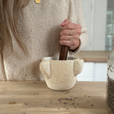 Handmade ceramic mortar and pestle inspired by ancient stone kitchen tools